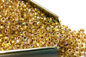 11/0 Charlotte Cut Beads: Patina Dull Gold Lined Aurore Boreale